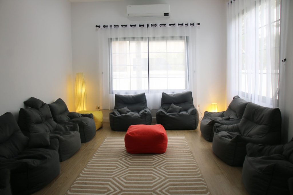 Comfortable addiction therapy room with beanbag chairs