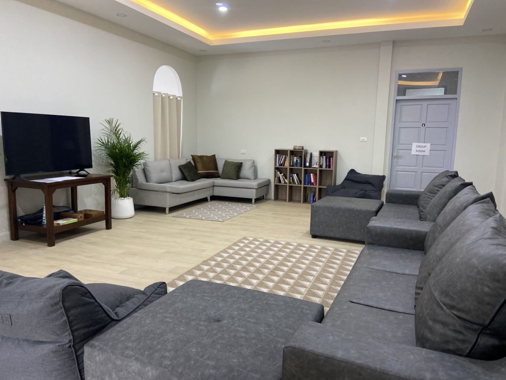 Chiang Mai rehab communal lounge and games room with sofas