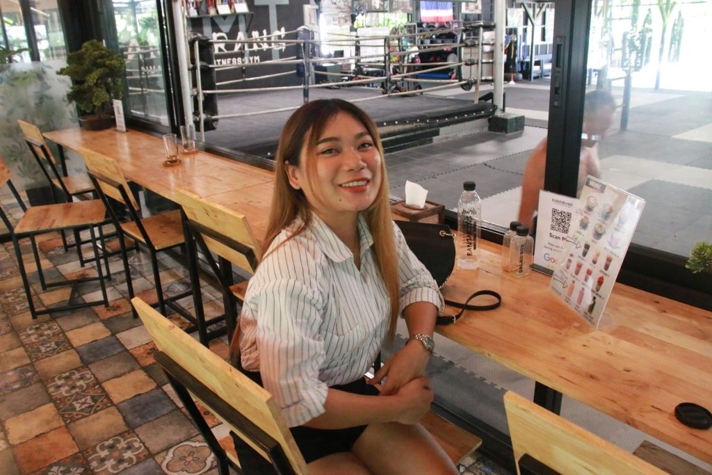 Friendly female receptionist waiting to greet guests
