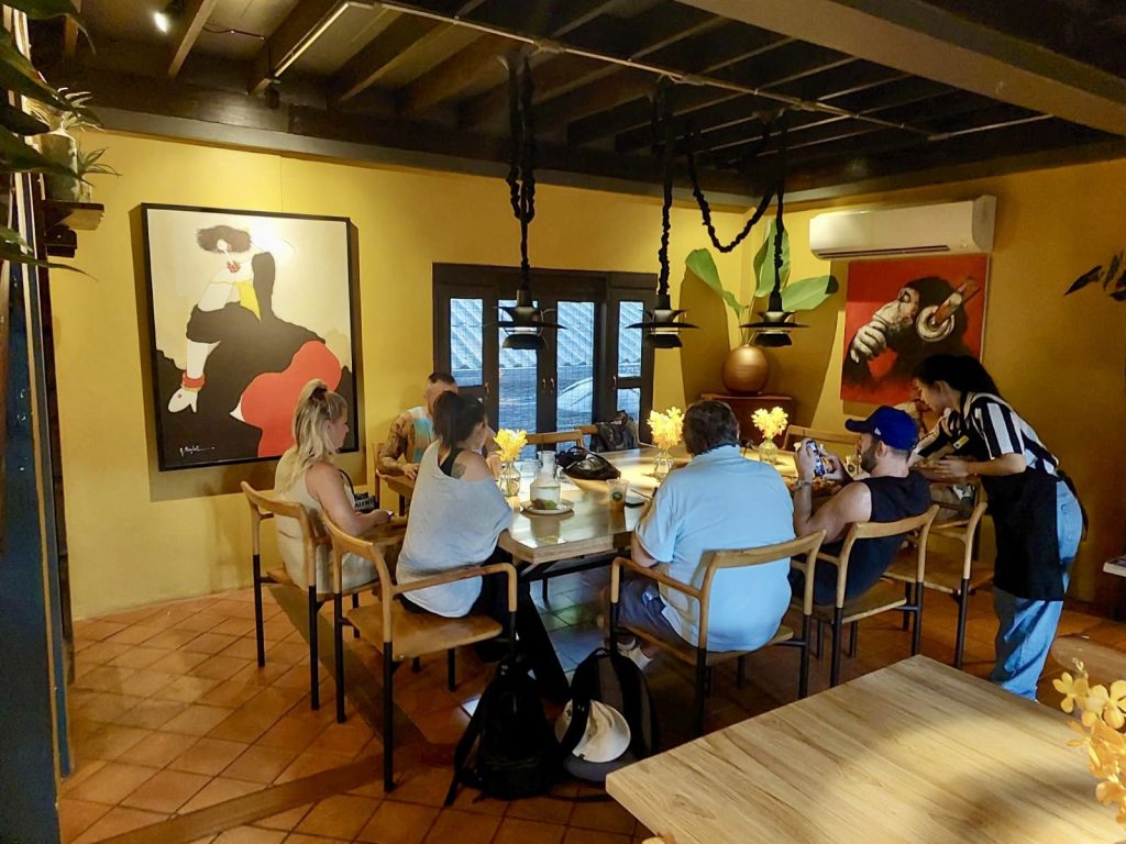 12 steps recovery group sits at table in Lanna restaurant