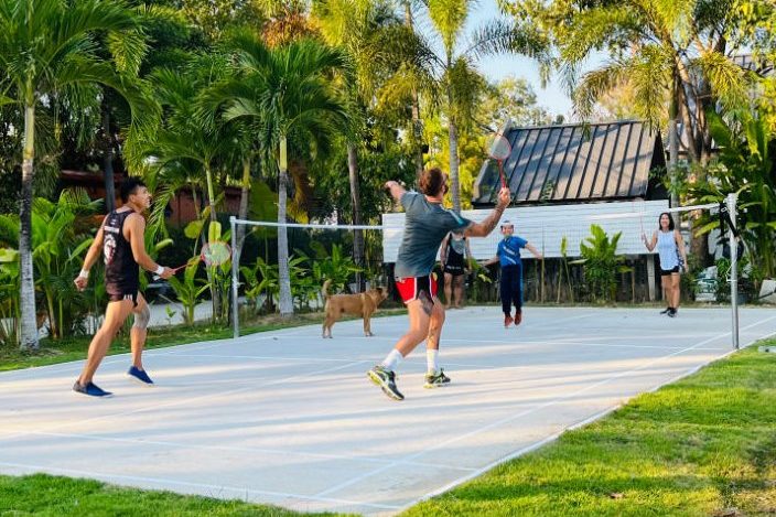 Ketamine recovery group play badminton in garden of One Step rehab
